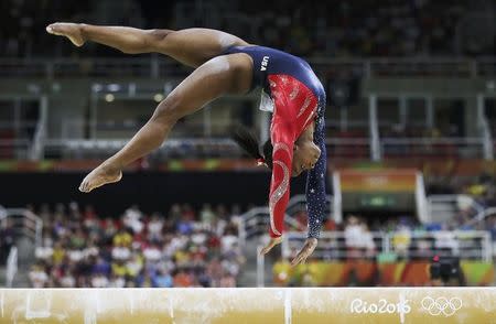 2016 Rio Olympics - Artistic Gymnastics - Preliminary - Women's Qualification - Subdivisions - Rio Olympic Arena - Rio de Janeiro, Brazil - 07/08/2016. Simone Biles (USA) of USA competes on the beam during the women's qualifications. REUTERS/Damir Sagolj