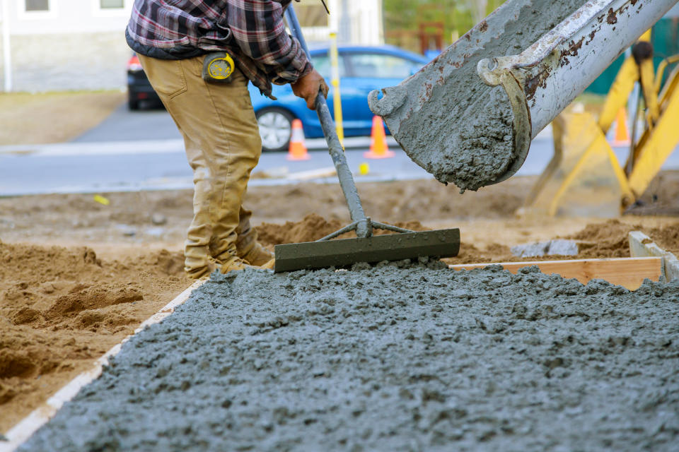 Cement mixer truck transport with pouring concrete to create for walking.