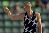 Sam Kendricks celebrates during the finals of the men's pole vault at the U.S. Olympic Track and Field Trials Monday, June 21, 2021, in Eugene, Ore. (AP Photo/Charlie Riedel)