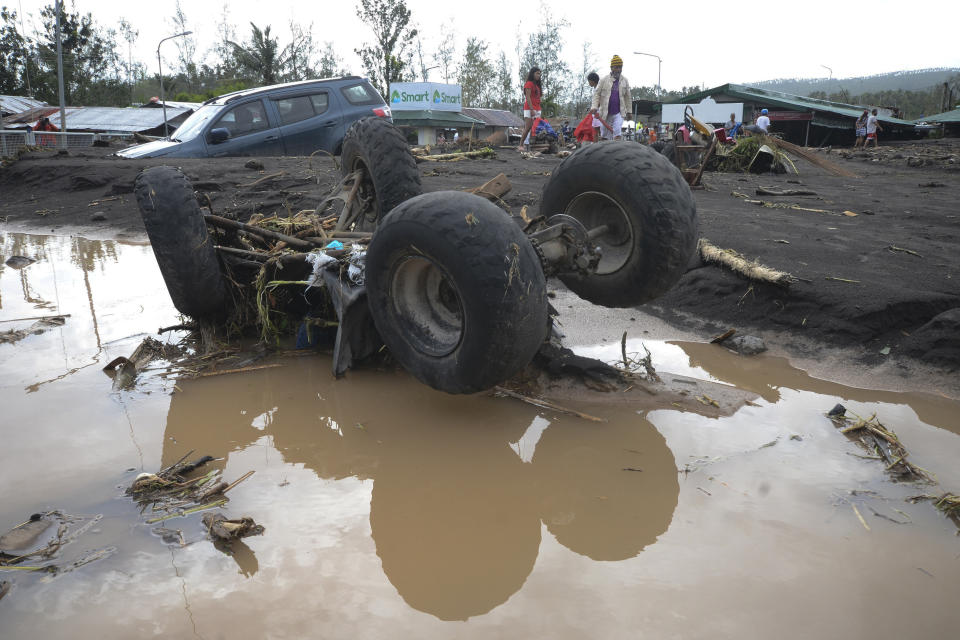 An All-Terrain Vehicle is toppled by strong winds and floods from Typhoon Goni as it hits Daraga, Albay province, central Philippines, Sunday, Nov. 1, 2020. The super typhoon slammed into the eastern Philippines with ferocious winds early Sunday and about a million people have been evacuated in its projected path, including in the capital where the main international airport was ordered closed. (AP Photo)