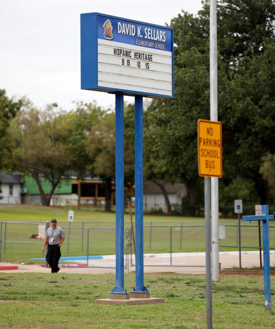 A security guard returns to his vehicle after closing the gate to the back parking lot of David K. Sellers Elementary School on Wednesday, October 11, 2023, in Forest Hill. A staff member was fatally shot Wednesday morning in the back parking lot.