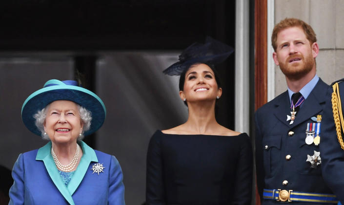 File photo dated 10/7/2018 of Queen Elizabeth II with the Duke and Duchess of Sussex on the balcony at Buckingham, Palace where they watched a Royal Air Force flypast over central London to mark the centenary of the Royal Air Force. The Duchess of Sussex gave birth to a 7lb 11oz daughter, Lilibet 