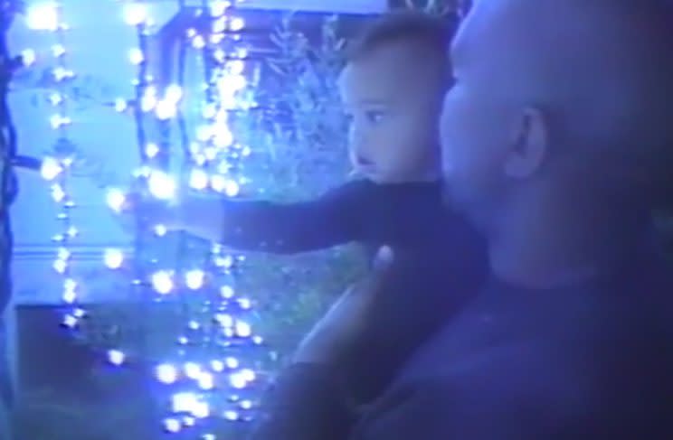 Kanye excitedly showed baby Saint their Christmas lights.