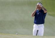 U.S. golfer Bubba Watson waits to putt on the seventh hole during the third round of the Masters golf tournament at the Augusta National Golf Club in Augusta, Georgia April 12, 2014. REUTERS/Jim Young