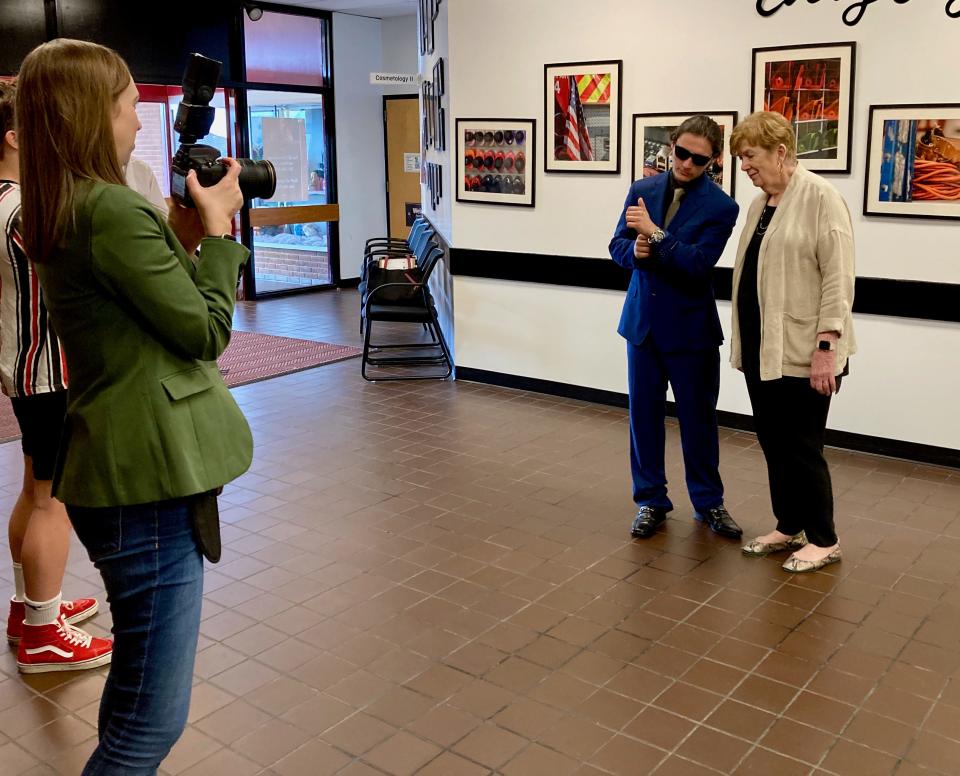 Washington County Public Schools spokesperson Erin Anderson takes a photo Thursday of former CIA Chief of Disguise Jonna Mendez with Aidyn Wood, a senior at the Boyd J. Michael III Technical High School. Aidyn, a cybersecurity student, hammed it up a bit for some of the photos.