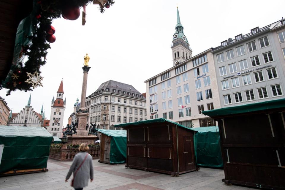 People walk past the cancelled Christmas market in Munich  (Getty Images)