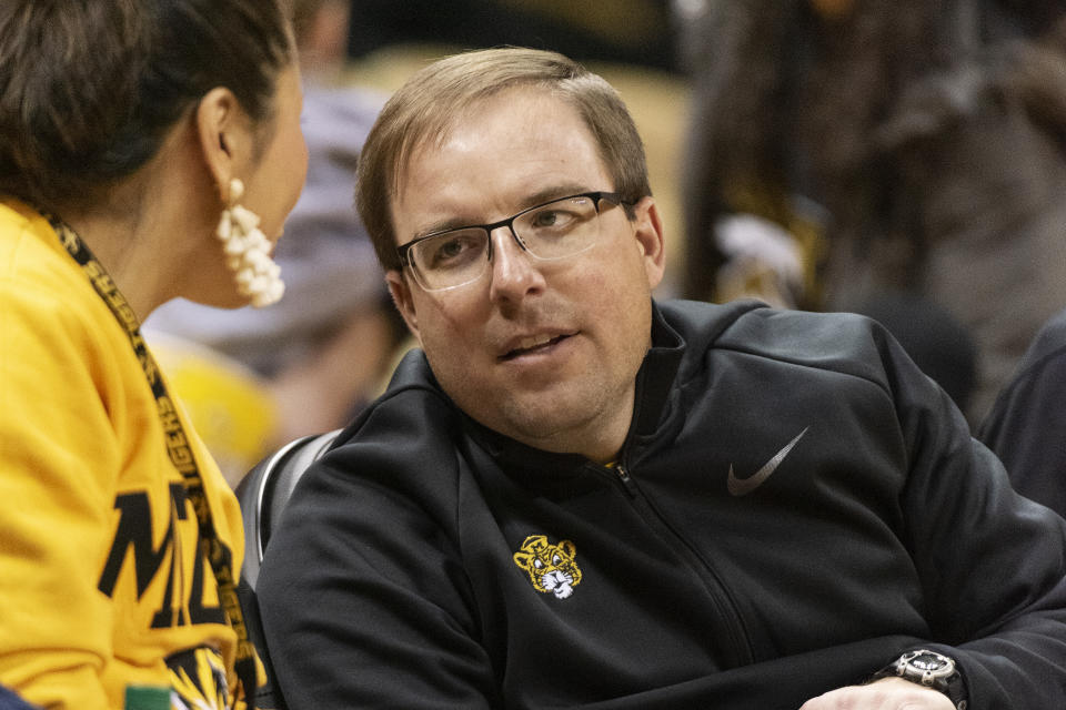 Missouri football coach Eliah Drinkwitz talks with a fan during an NCAA college basketball game on Jan. 11. (AP)