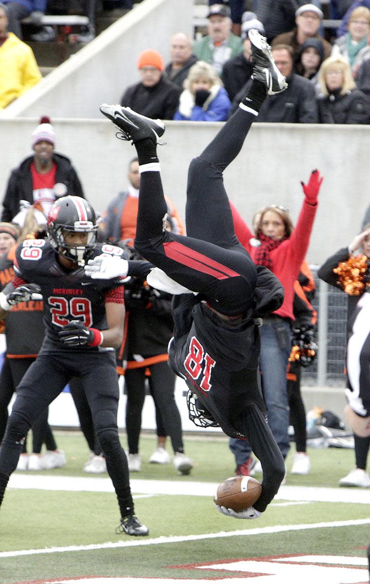 McKinley QB Dominique Robinson scores the game-winning touchdown vs. Massillon in the final game at old Fawcett Stadium, Oct. 31, 2015.