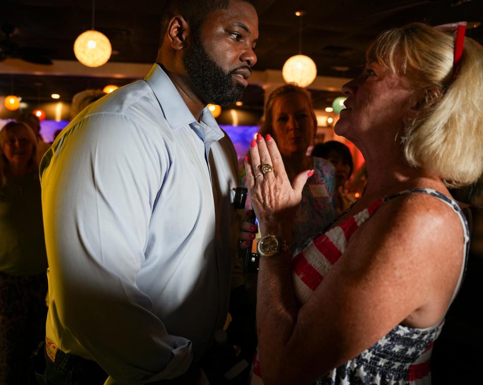 U.S. Rep. Byron Donalds, R-Fla., meets with attendees during an event hosted by the Naples Republican Club at Stix Sushi and Seafood in Naples on Tuesday, Aug. 8, 2023.