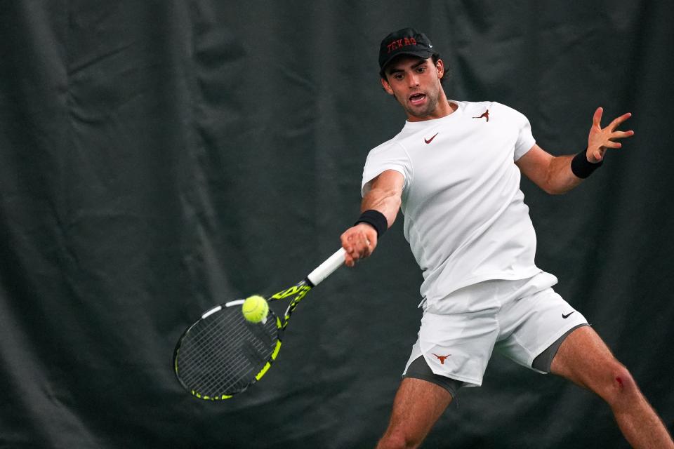 Texas' Eliot Spizzirri fires a forehand against UCLA in the second round of the NCAA Tennis Tournament at the Weller Tennis Center on Saturday. Spizzirri helped pick up a doubles point as Texas rolled into the round of 16 with a 4-0 win.
