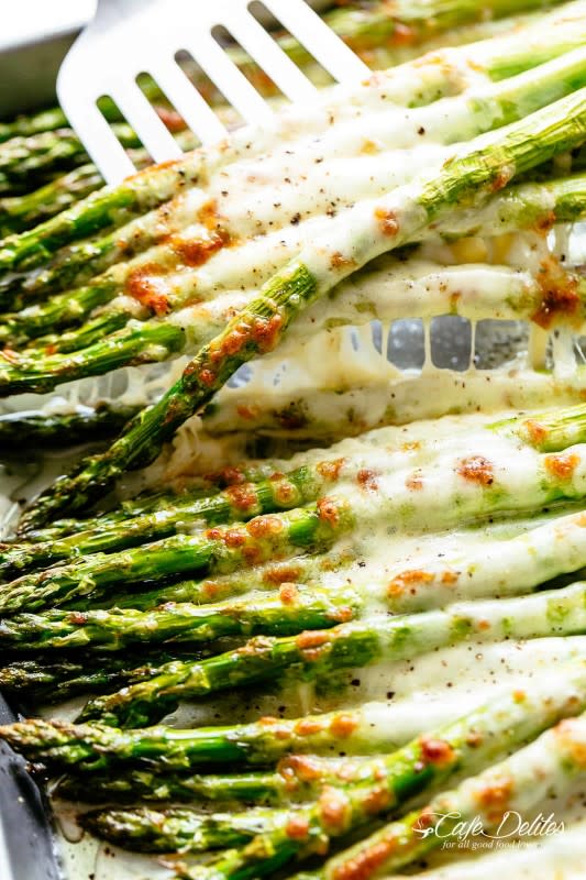 <p>Cafe Delites</p><p>Quite possibly the most popular asparagus recipe on the internet, and for good reason. </p><p><strong>Get the recipe: <a href="https://cafedelites.com/cheesy-garlic-roasted-asparagus/" rel="nofollow noopener" target="_blank" data-ylk="slk:Cheesy Garlic Roasted Asparagus;elm:context_link;itc:0;sec:content-canvas" class="link ">Cheesy Garlic Roasted Asparagus</a> </strong></p>