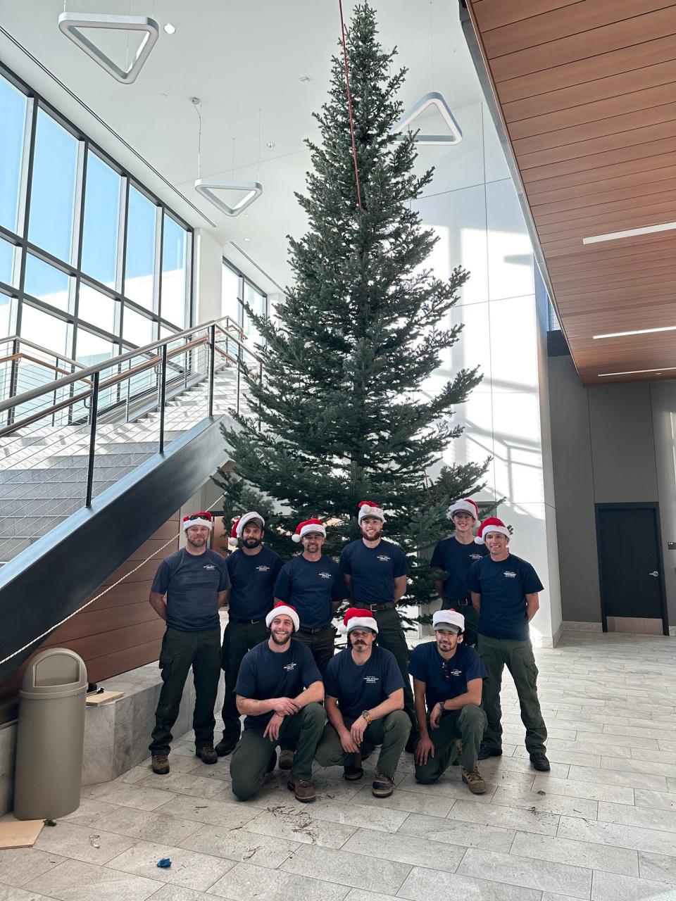 A group of Larimer County Sheriff's Office wildland firefighters — the Initial Attack Module — carried in and decorated a two-story Christmas tree in the employee lobby at the Larimer County Sheriff's Office in December 2023.