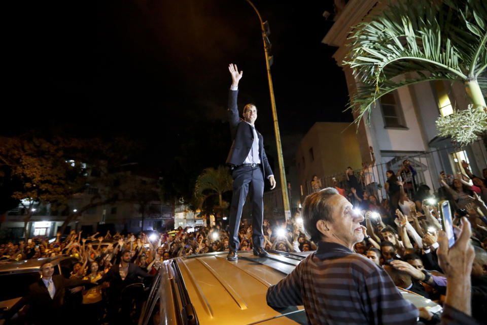 Venezuelan Congress President Juan Guaido greets the crowd after Ash Wednesday Mass celebrations in Caracas, Venezuela, Wednesday, March 6, 2019. The U.S. and more than 50 governments recognize Guaido as interim president, saying President Nicolas Maduro wasn't legitimately re-elected last year because opposition candidates weren't permitted to run. (AP Photo/Eduardo Verdugo)