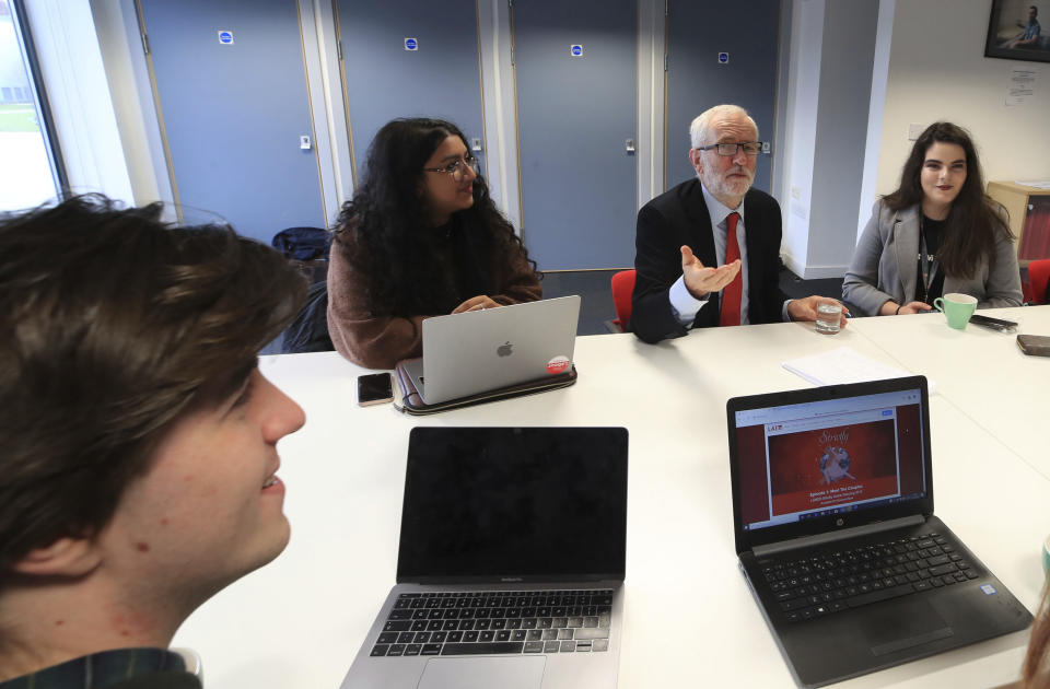 Britain's Labour Party leader Jeremy Corbyn talks with students at Lancaster University regarding the party's plans to deliver fast and free full fibre broadband across the country, during the General Election campaign trail, in Lancaster, England, Friday, Nov. 15, 2019. Britain goes to the polls on Dec. 12. (Peter Byrne/PA via AP)