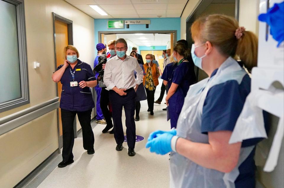 Labour leader Sir Keir Starmer alongside NHS staff during a visit to Royal Derby Hospital (PA)