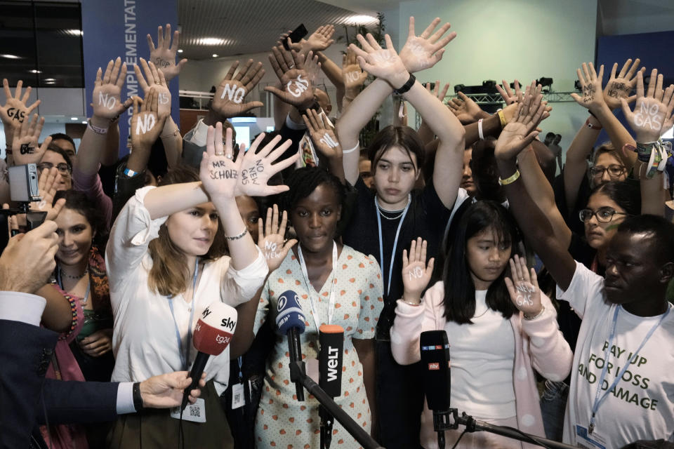 Climate activists Luisa Neubauer, of Germany, left, and Vanessa Nakate, of Uganda, center, Helena Marschall, of Germany, center right, and Licypriya Kangujam, of India, joined by others of Fridays for Future protest against Germany's Olaf Scholz's climate policy at the COP27 U.N. Climate Summit, Tuesday, Nov. 8, 2022, in Sharm el-Sheikh, Egypt. (AP Photo/Nariman El-Mofty)