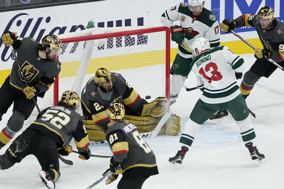 Minnesota Wild center Nick Bonino (13) scores on Vegas Golden Knights goaltender Marc-Andre Fleury (29) during the second period of an NHL hockey game Monday, March 1, 2021, in Las Vegas. (AP Photo/John Locher)