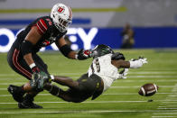 Oregon cornerback Trikweze Bridges (11) attempts to recover a fumble by Utah quarterback Cameron Rising, not seen, as Utah offensive lineman Sataoa Laumea (78) also looks to recover the ball during the first half of the Pac-12 Conference championship NCAA college football game Friday, Dec. 3, 2021, in Las Vegas. (AP Photo/Chase Stevens)