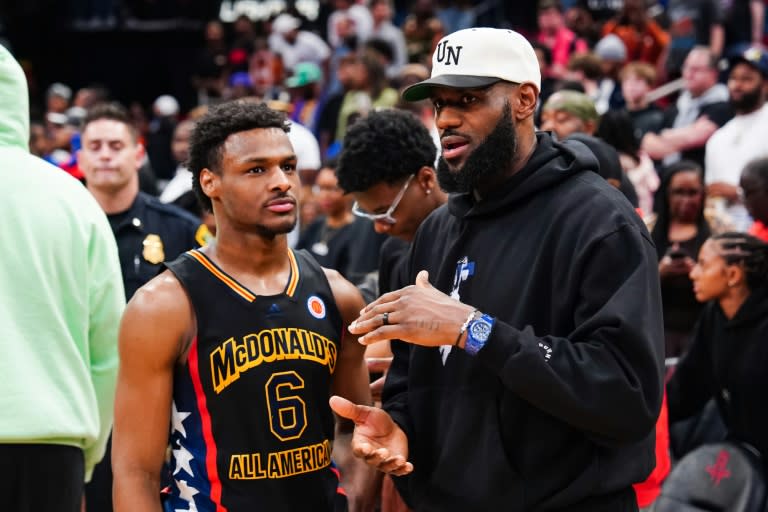 Bronny James, left, was selected by the <a class="link " href="https://sports.yahoo.com/nba/teams/la-lakers/" data-i13n="sec:content-canvas;subsec:anchor_text;elm:context_link" data-ylk="slk:Los Angeles Lakers;sec:content-canvas;subsec:anchor_text;elm:context_link;itc:0">Los Angeles Lakers</a> with the 55th pick in the NBA Draft and could become the first NBA father-son combination playing for the Lakers alongside his superstar father, <a class="link " href="https://sports.yahoo.com/nba/players/3704/" data-i13n="sec:content-canvas;subsec:anchor_text;elm:context_link" data-ylk="slk:LeBron James;sec:content-canvas;subsec:anchor_text;elm:context_link;itc:0">LeBron James</a>, right (Alex Bierens de Haan)