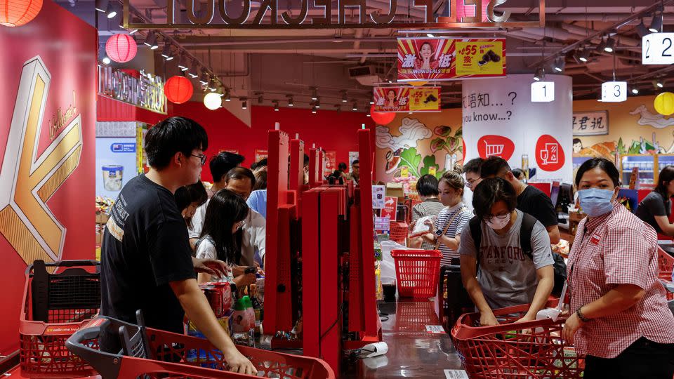 Hong Kong residents stock up as Typhoon Saola approaches on August 31. - Tyrone Siu/Reuters