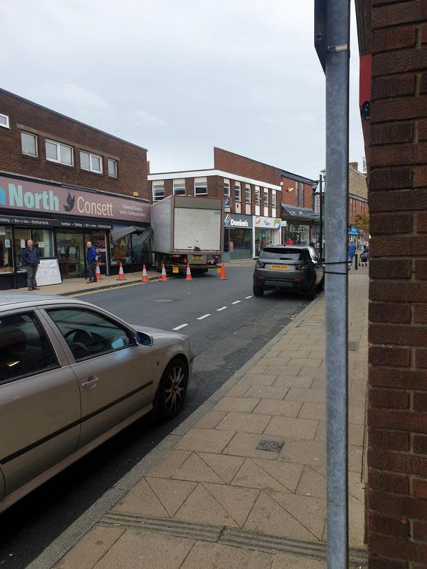 The Northern Echo: A HGV crashes into Delta North Charity shop in Consett, County Durham. Picture: CONSETT CHATTER BOX 2