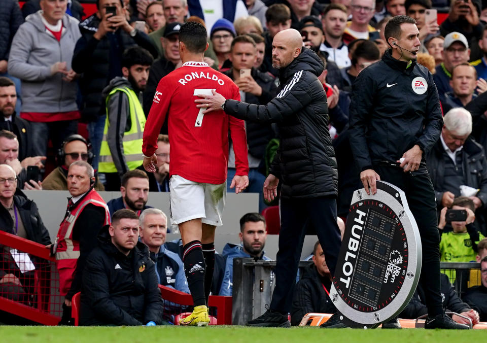 Manchester United's Cristiano Ronaldo with manager Erik ten Hag after being substituted during a Premier League match.