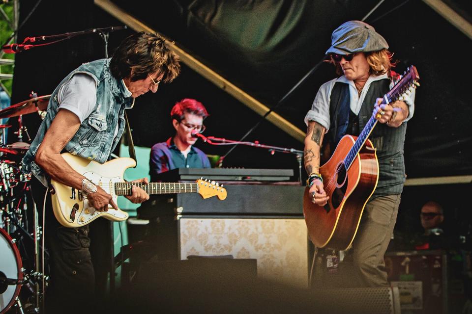 HELSINKI, FINLAND - JUNE 19: Johnny Depp (R) performs on stage with Jeff Beck (L) during the Helsinki Blues Festival at Kaisaniemen Puisto on June 19, 2022 in Helsinki, Finland. (Photo by Venla Shalin/Redferns)