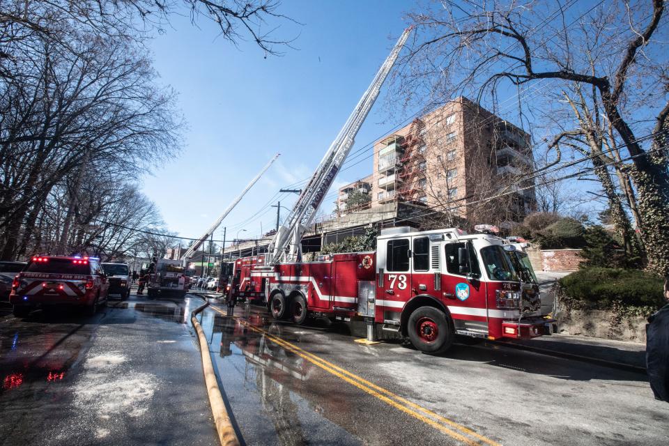 Firefighters work at the scene of an overnight fire at 671 Bronx River Rd. In Yonkers March 8, 2023. One resident was killed in the fire and at least 60 families were displaced.
