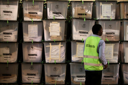 An Independent Electoral and Boundaries Commission (IEBC) official looks at ballot boxes at a tally centre in Nairobi, Kenya October 27, 2017. REUTERS/Siegfried Modola