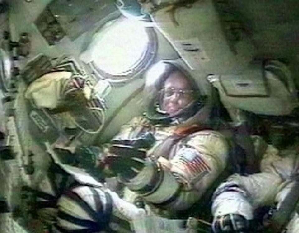 FILE - In this Saturday, April 28, 2001 image from video made available by the Russian Space Agency, U.S. space tourist, California millionaire Dennis Tito sits inside the cockpit of the Soyuz spaceship, at the Baikonur cosmodrome in Kazakstan, before he and Russian cosmonauts Talgat Musabayev and Yuri Baturin travel to the International Space Station. (Russian Space Agency via AP)