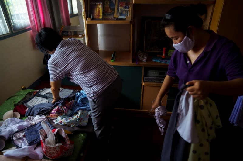 The Wider Image: Calls to suicide helpline show Thais' stress in downturn