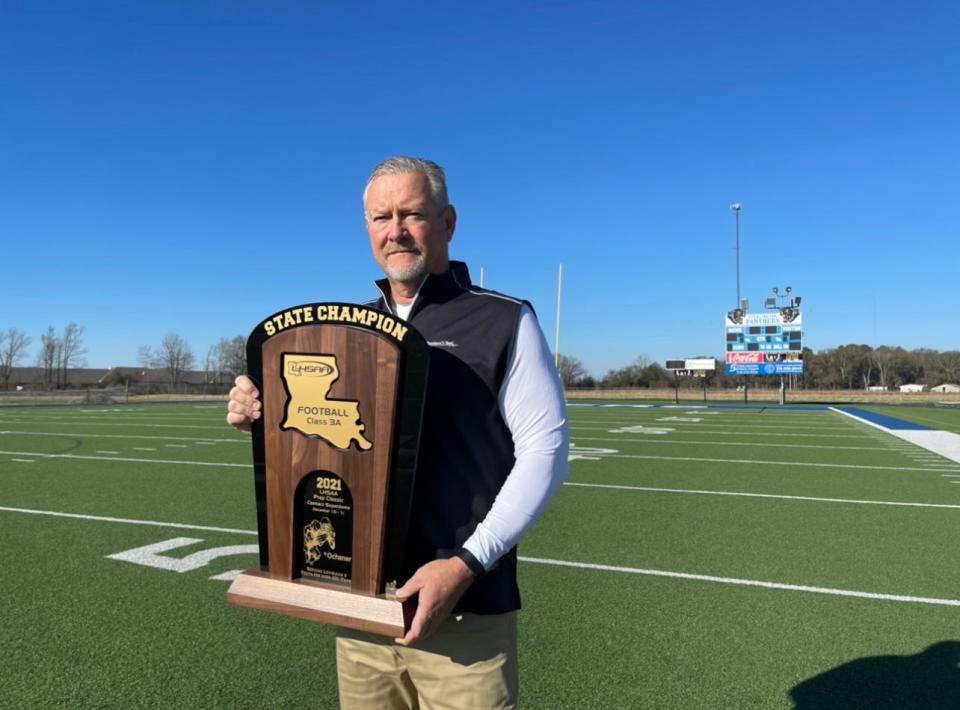 Sterlington football coach Lee Doty with LHSAA Class 3A State Championship trophy. Doty led the Panthers to a 15-0 season.