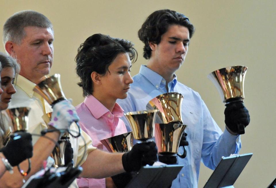 Performing on the hand bells are Celestial Ringers members, from left, Paul Allen, of Pembroke; and Dave Won Jr. and Jack Murray, both of Norwell, during the "Spring Ring" hand bell concert at the United Church of Christ in Norwell, Sunday, June 12, 2022.