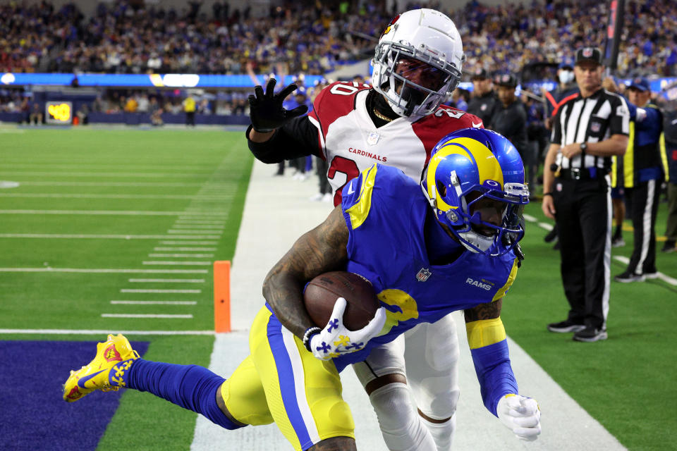 INGLEWOOD, CALIFORNIA - JANUARY 17: Marco Wilson #20 of the Arizona Cardinals unsuccessfully attempts to stop Odell Beckham Jr. #3 of the Los Angeles Rams from scoring a touchdown in the first quarter of the NFC Wild Card Playoff game at SoFi Stadium on January 17, 2022 in Inglewood, California. (Photo by Harry How/Getty Images)