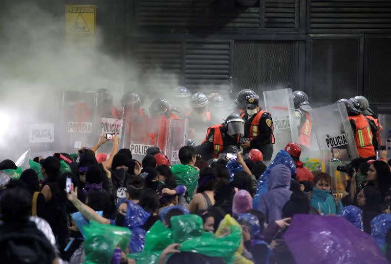 People take part in a protest against gender-based violence in downtown of Mexico City