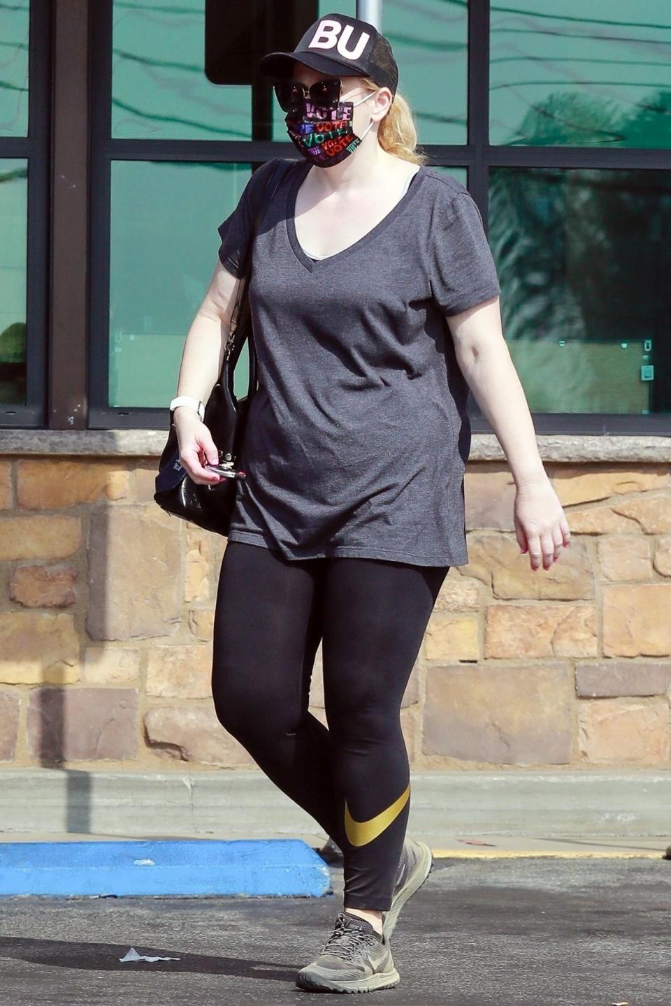 <p>Rebel Wilson wears a mask that says "vote" on her way to get groceries on Sunday in Los Feliz, California.</p>