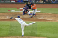 Houston Astros' Jose Altuve (27) hits a three-run home run off Texas Rangers relief pitcher Jose Leclerc (25) during the ninth inning in Game 5 of the baseball American League Championship Series Friday, Oct. 20, 2023, in Arlington, Texas. (AP Photo/Tony Gutierrez)