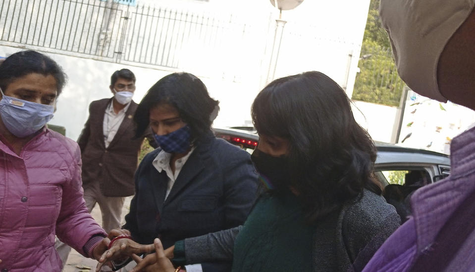 Climate activist Disha Ravi, 22, walks outside a court in New Delhi, India, Friday, Feb. 19, 2021. An Indian court on Friday sent the activist to judicial custody for three days. Ravi was arrested for circulating a document on social media supporting months of massive protests by farmers in India. Her arrest marks the latest example of a crackdown on dissent under Prime Minister Narendra Modi’s government, critics say. (AP Photo/Dinesh Joshi)