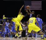 Michigan's Glenn Robinson III (1) and Kentucky's Alex Poythress (22) go after a rebound during the second half of an NCAA Midwest Regional final college basketball tournament game Sunday, March 30, 2014, in Indianapolis. (AP Photo/David J. Phillip)