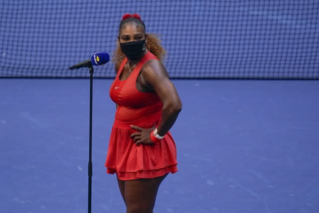 Serena Williams looks over to her daughter during an interview following her win over Sloane Stephens