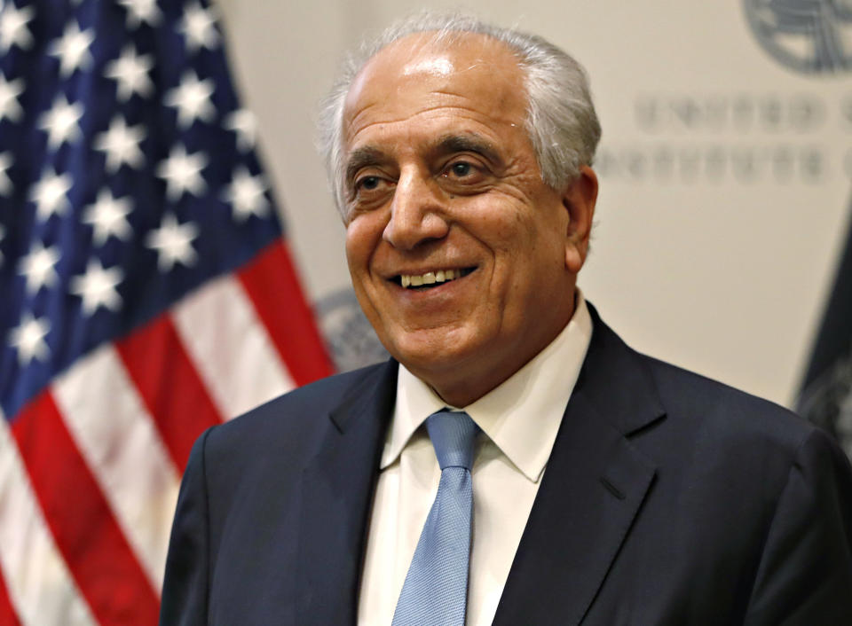 FILE - In this Feb. 8, 2019, file photo, Special Representative for Afghanistan Reconciliation Zalmay Khalilzad smiles at the U.S. Institute of Peace, in Washington. Khalilzad, U.S. peace envoy to Afghanistan, is in Beijing for a previously scheduled meeting, an American Embassy spokesman said Thursday, July 11, 2019, amid signs of new momentum in efforts to end Afghanistan's 17-year war and push by China to boost its influence in the region. (AP Photo/Jacquelyn Martin, File)