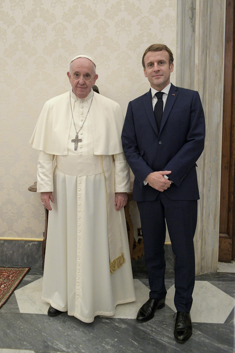 French President Emmanuel Macron, right, poses with Pope Francis during a private audience at the Vatican, Friday, Nov. 26, 2021. (Vatican Media via AP)