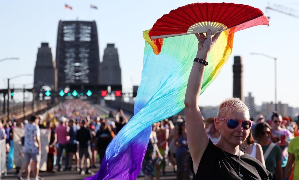 <span>People take part in a pride march over the Sydney Harbour Bridge in March 2023. The 2026 census will include a new single topic on gender and sexual orientation, the treasurer announced on Sunday.</span><span>Photograph: David Gray/JM/Getty Images for Destination New South Wales</span>