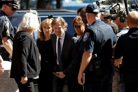 Actress Felicity Huffman and husband William H. Macy arrive at the federal courthouse in Boston