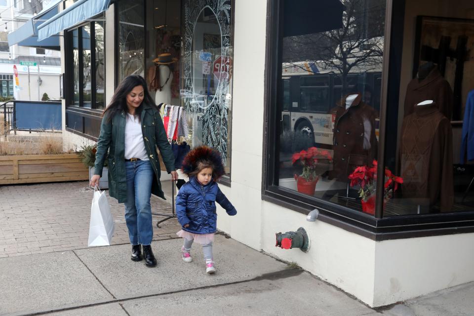 Maria Colaco of Katonah and her three-year-old daughter Charlie Colaco-Curry walk in downtown Katonah, Jan. 6, 2022. Maria had grand plans for a better Christmas in 2021, but she got sick with COVID, then her toddler daughter tested positive, and then her two other kids got it later on. They had to cancel their Christmas plans, including a visit from out of town family.