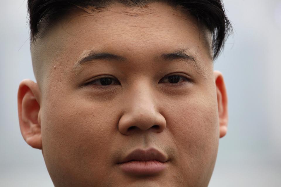 Howard appears as a Kim Jong-un lookalike on a street at Hong Kong's Tsim Sha Tsui shopping district