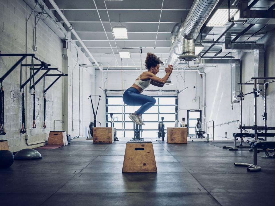 woman cross training in a gym