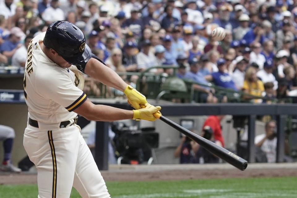 Milwaukee Brewers' Hunter Renfroe hits a two-run home run during the fifth inning of a baseball game against the Los Angeles Dodgers Thursday, Aug. 18, 2022, in Milwaukee. (AP Photo/Morry Gash)