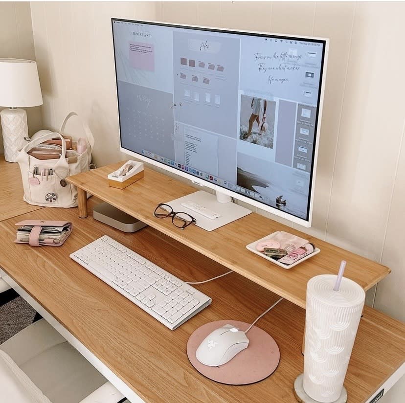 Wooden desk with Macbook on wooden riser