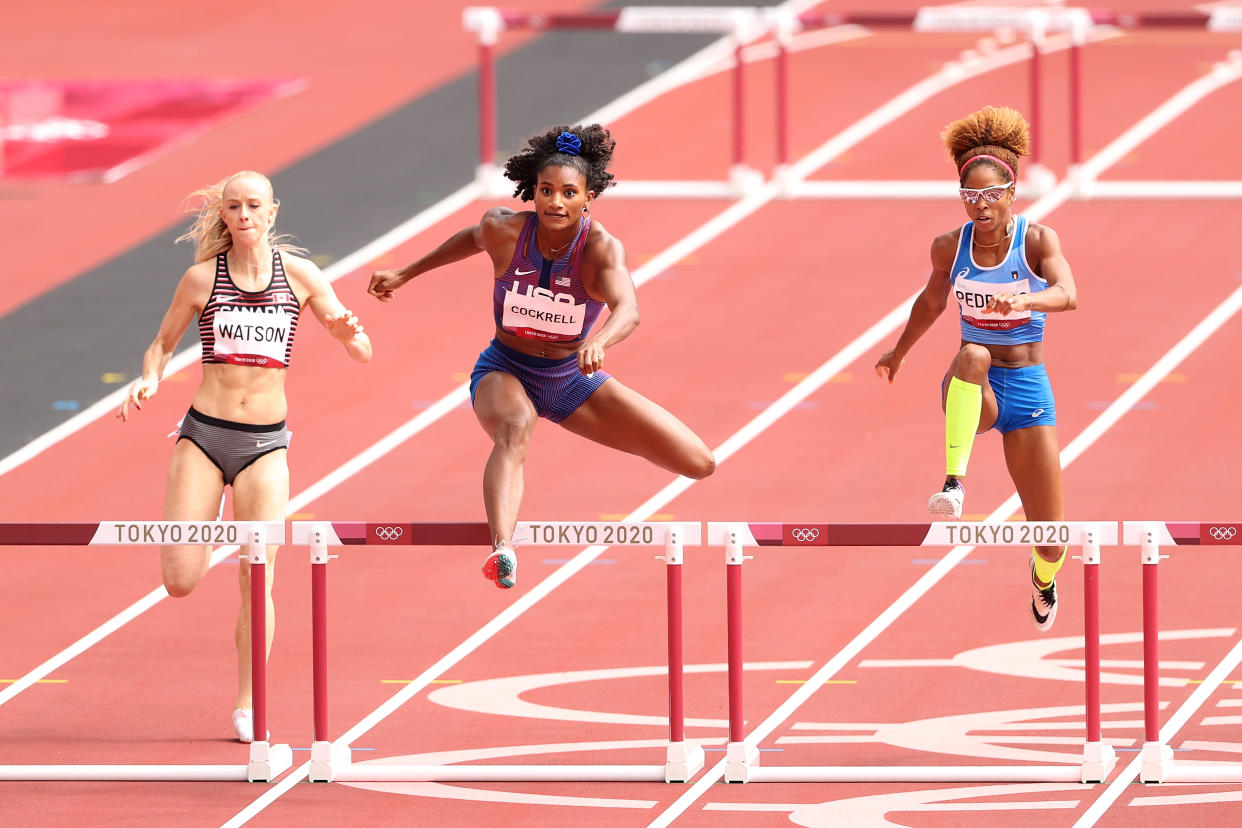 TOKYO, JAPAN - JULY 31: Anna Cockrell (center) of Team United States competes against Sage Watson of Team Canada and Yadisleidis Pedroso of Team Italy in the Women's 400m Hurdles Round 1 - Heat 1 on day eight of the Tokyo 2020 Olympic Games at Olympic Stadium on July 31, 2021 in Tokyo, Japan. (Photo by Christian Petersen/Getty Images)